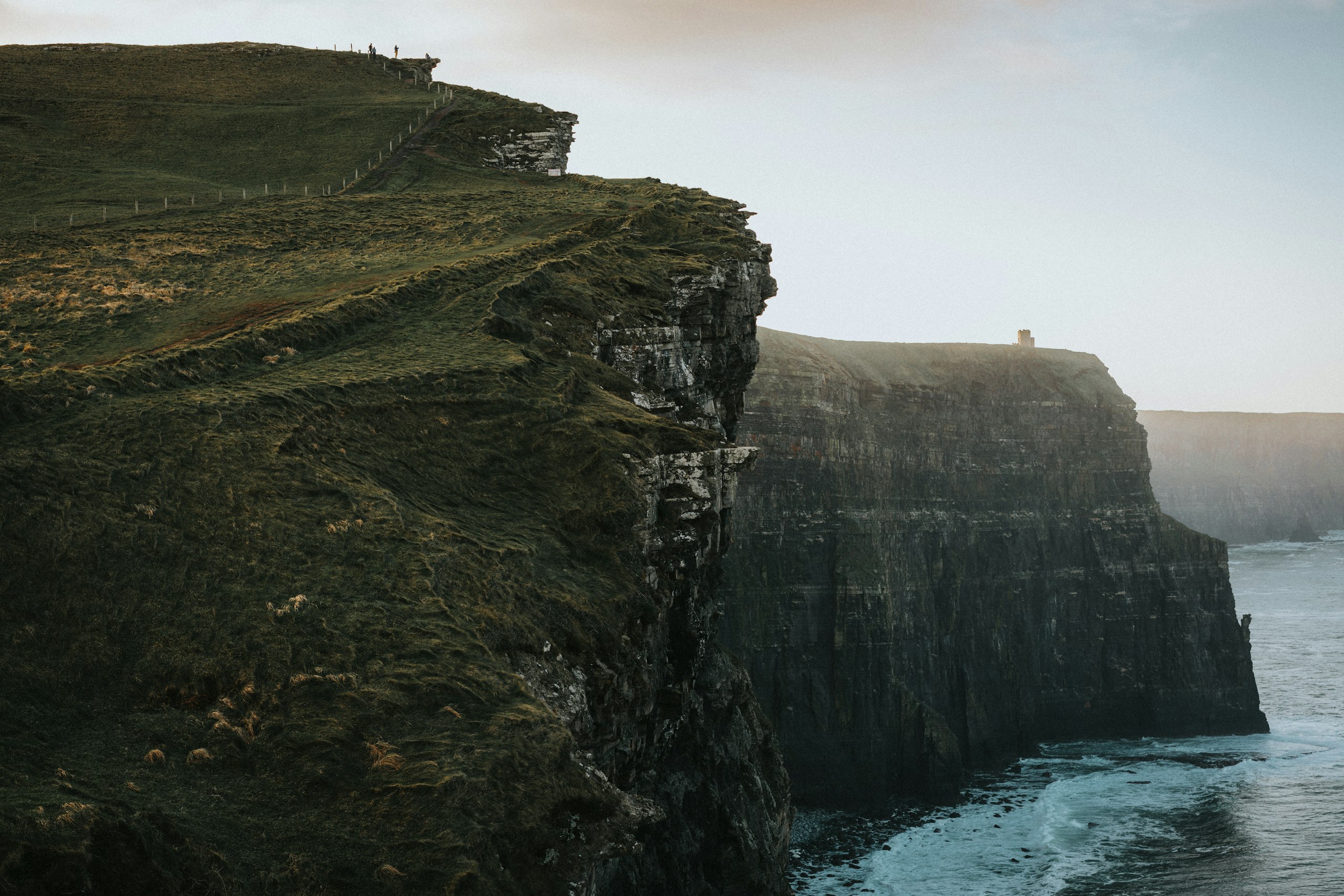 Grass-topped cliffs above the sea on the Wild Atlantic Way